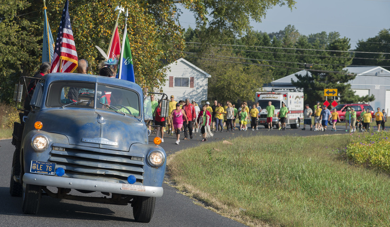 Approximately 60 people joined the Unity Run/Walk as the truck "Possum" leads the way.